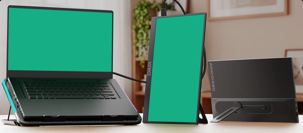 Obsidian Portable V2 in portrait and landscape beside a laptop on a desk