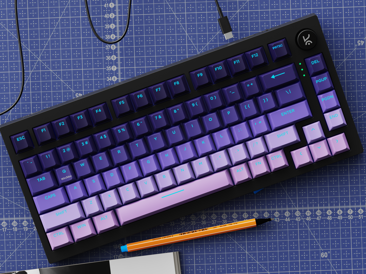 Swarm 75 on a cutting mat with its USB-C cable